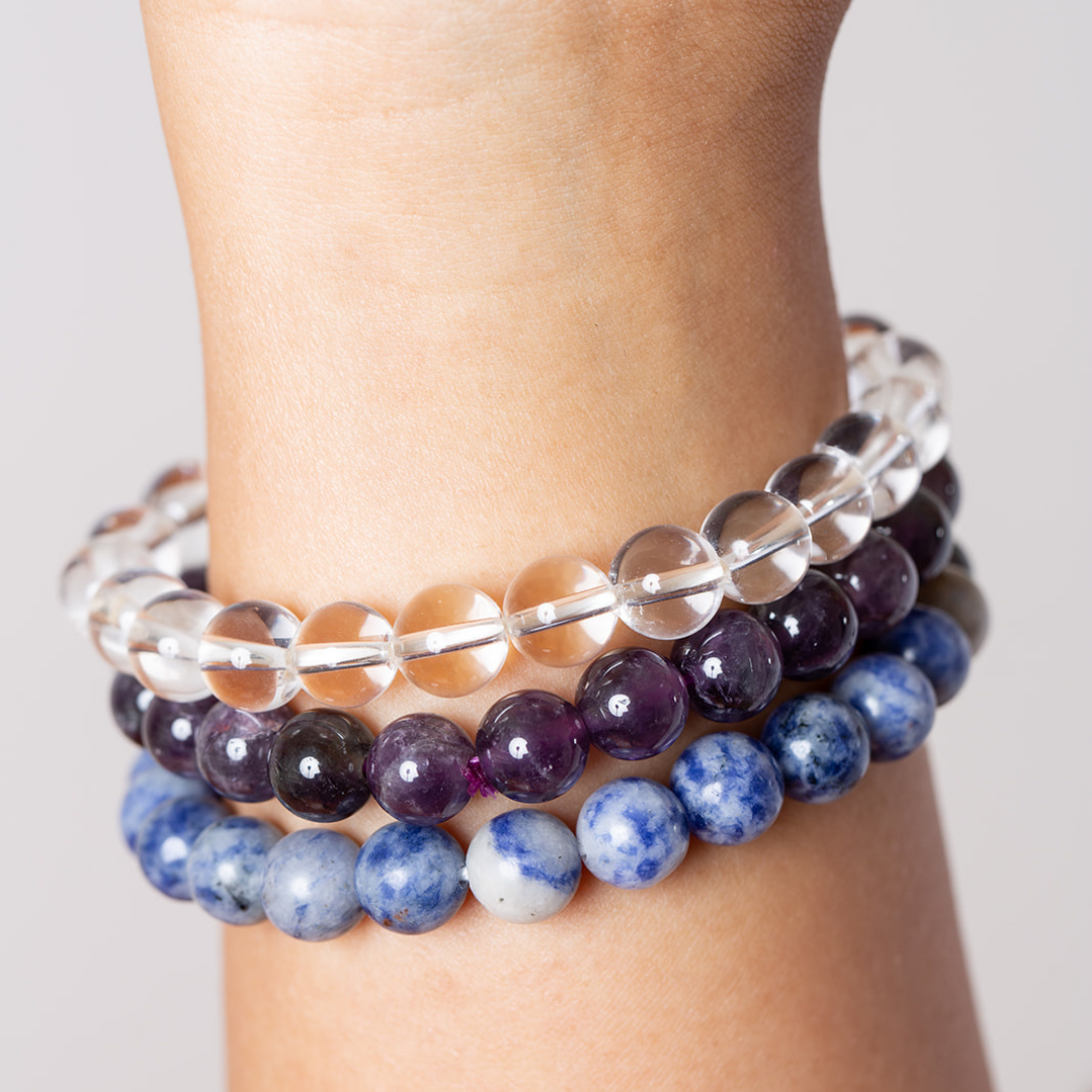 Women's wrist withAmbarya clear quartz, amethyst and sodalite mala beads